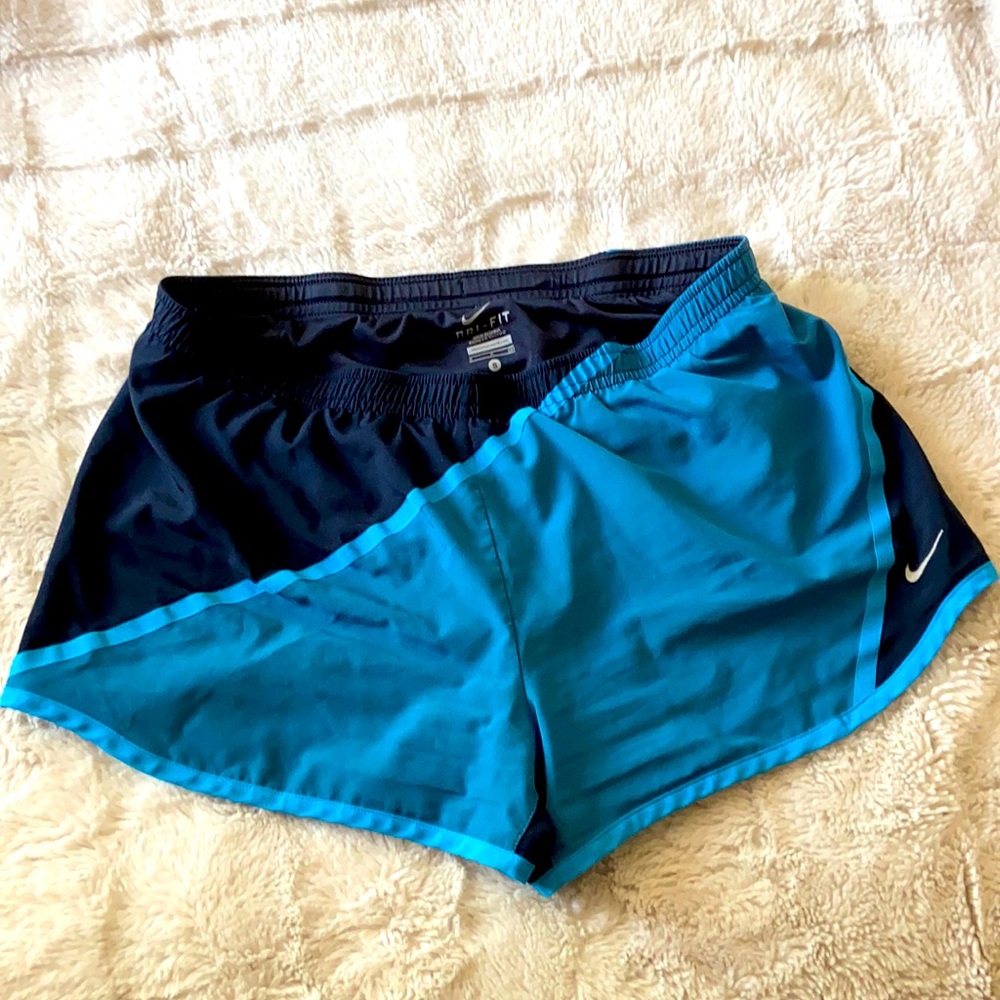 navy and blue women’s nike running shorts